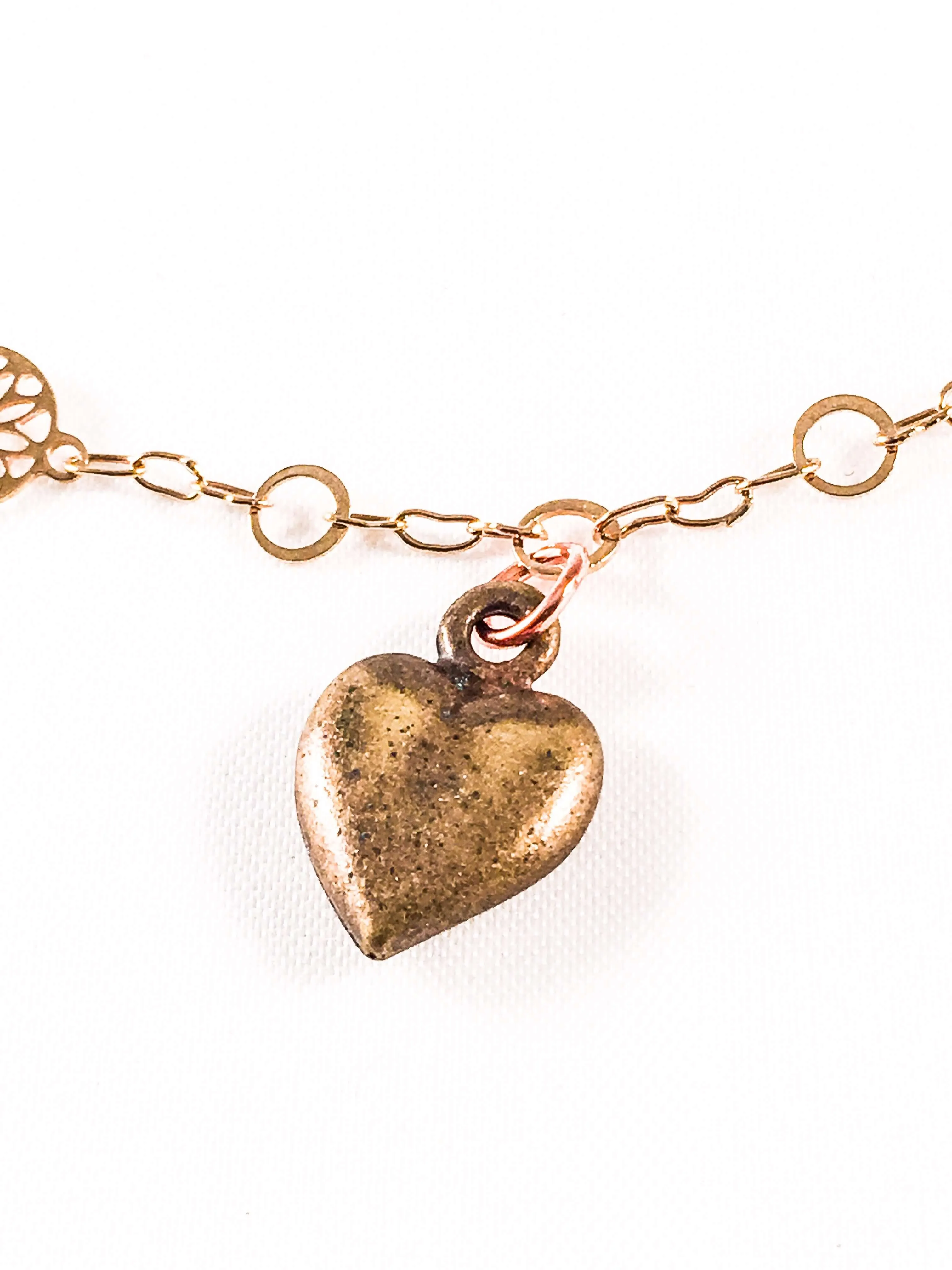 Bronze Heart Charm Necklace with 18kt Gold Plated Flower Chain.